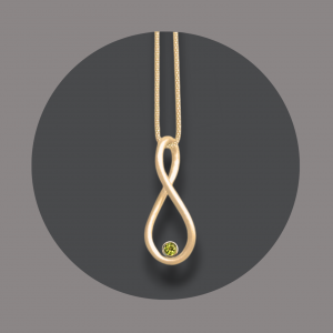 Infinity Anhänger goldplattiert Peridot